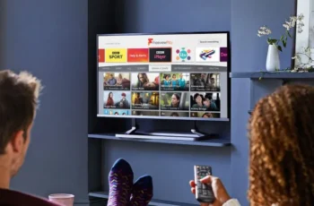 Two people using a streaming service on a T.V.