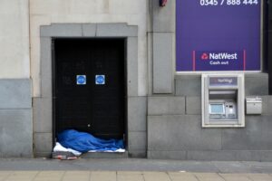 Image of a homeless individual in the street