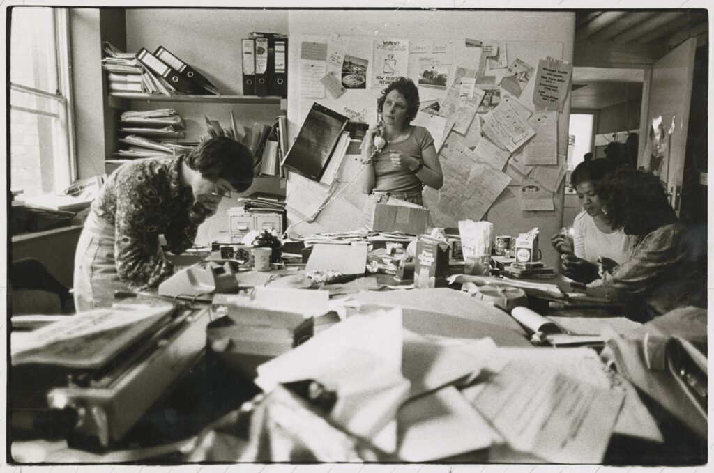 A group of women around a desk at the National Women's Aid Federation Office 1978. Credit: Women's Aid Federation of England 